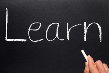 The word Learn written on a blackboard.