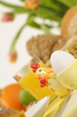 an easter table setting with fresh products and tulips