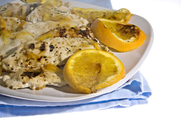 Grilled chicken with ornages and orange marmalade sauce.
