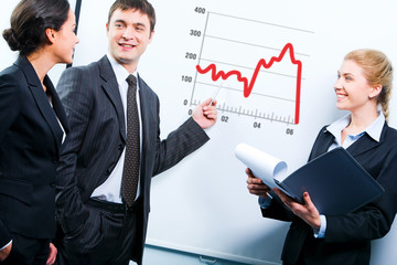 Teacher demonstrating a graphic of development strategy 