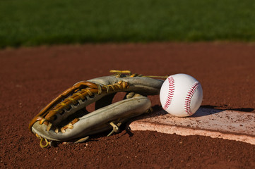 Baseball on the pitchers mound with a glove