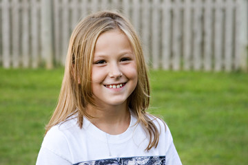Portrait of adorable girl, 8, with a pretty smile