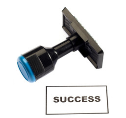 rubber stamp and the word success 