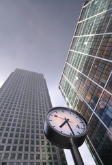 Clock in front of office buildings, London