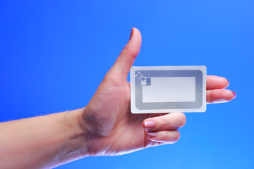 woman holding Radio-frequency identification (RFID) tag card