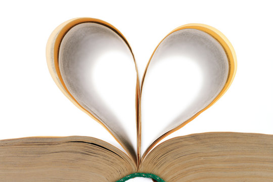 heart shape made from the leaves of the open book