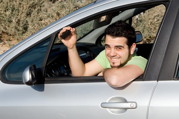 happy man with new car and key