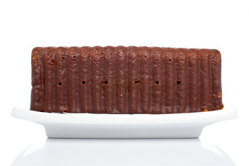 Chocolate cake reflected over white background. Shallow DOF