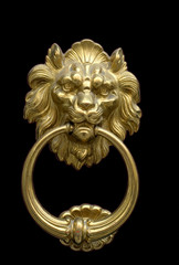 Impressive bronze doorknocker with Lion on a black background