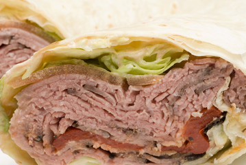 roast beef pita wrap sandwich with lettuce tomotoes