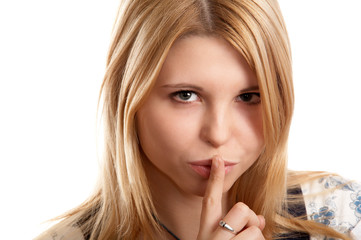 Blonde woman on white background with silence sign.