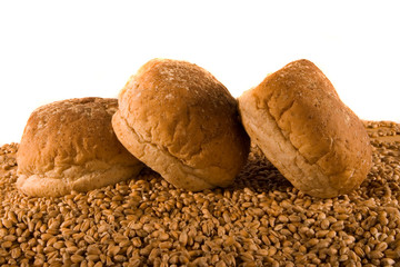 Three Brown Rolls on Wheat