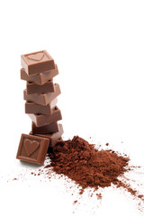 stack of chocolates and cocoa isolated on white