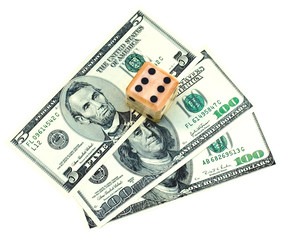 Close up of dice on dollars