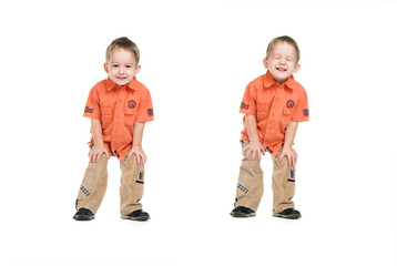 The little boy on a white background in a red shirt