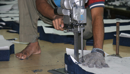 CUTTING FABRIC ON CUTTING TABLE