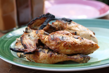 whole grilled chicken on plate
