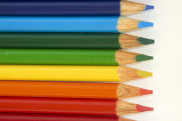 Coloured pencil crayons isolated on a white background