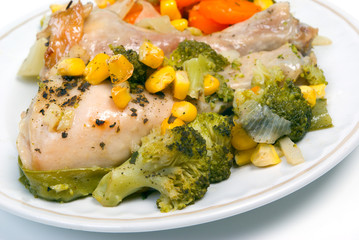 Delicious roasted chicken drumsticks with baked vegetables...
