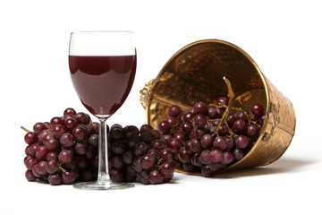 Red grapes and a glass of red wine