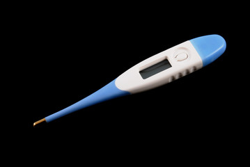 The medical electronic thermometer on a black background