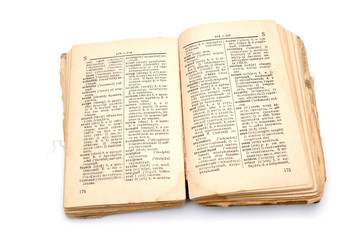 The open old book - the dictionary on a white background