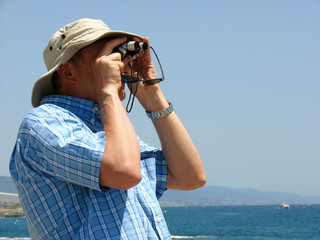 man looking in the field-glass