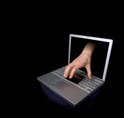 Credit card being stolen by a hand through the 'internet'. 