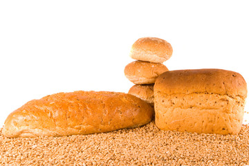 Three Brown Rolls, Two Brown Loaves on Wheat Grains