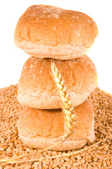 Three Brown Rolls and Wheat Ear and Grains