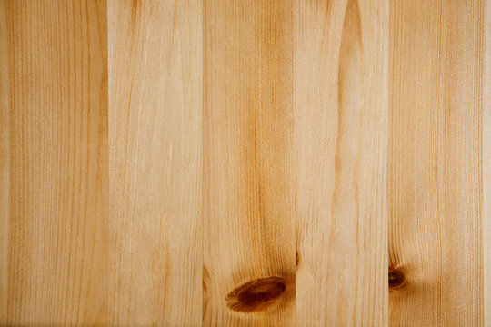 A light colored pine wood panneling background texture