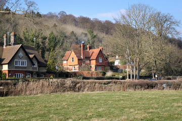 Fototapeta na wymiar English Rural Houses set on Wooded Hillside