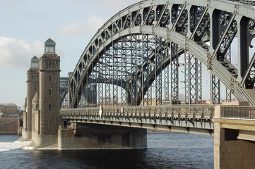Bridge across the river. Blue sky.