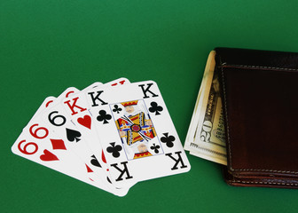 cards and purse on a gambling-table