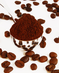 Spoon of coffee on a background grains