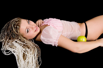 Portrait girl with apple on black background