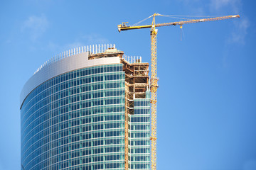 Fototapeta premium Construction of a skyscraper in Moscow, early morning