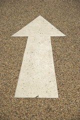 Arrow painted in a road surface