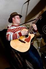 The musician with a guitar.  Concert of group StockDog.