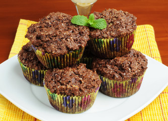 Plate of freshly baked chocolate chip muffins.