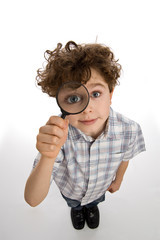 Boy holding magnifying glass
