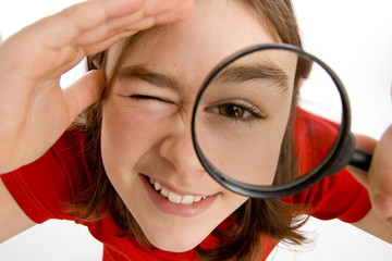 Girl holding magnifying glass