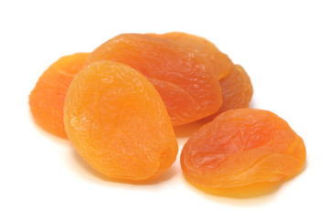 Delicious dried apricots on a white background