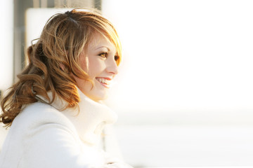 Naklejka premium smiling beautiful young woman