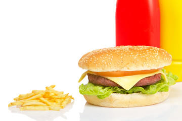 Cheeseburger, mustard, ketchup and french fries