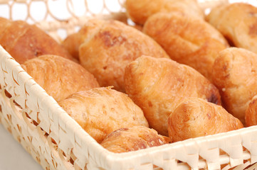 small croissants in basket