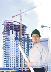 Young Architect standing in front of highrise