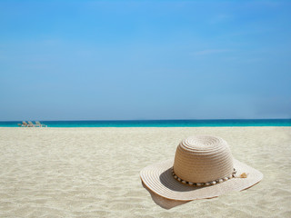 straw hat on the shore of a Caribbean beach
