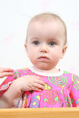baby in bright pink dress