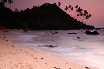 Stunning Cola beach sunset in Goa India.